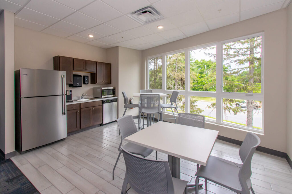 Kitchen with refrigerator and microwave for members
