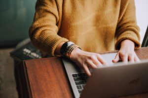 Professional working on a laptop at a desk